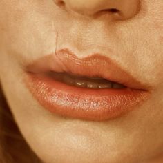 a woman's lips are shown with no makeup