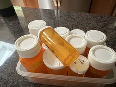 several bottles of liquid sitting on top of a counter