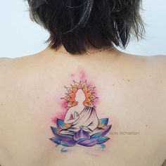 a woman with a tattoo on her back