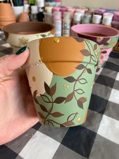 Artwork by @hervividroots Terra Cotta Planter Ideas, Painting Taracata Pots Diy, Hand Painted Terra Cotta Pots Boho, Acrylic Painted Pots, Mini Plant Pot Painting, Terracotta Pot Painting Ideas Boho, Painted Terra Cotta Pots Boho, Terra Cotta Pot Painting Ideas, Painting Terra Cotta Pots Ideas