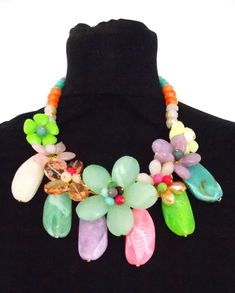 Stunning, chunky floral beaded statement necklace from Olivia Divine. Abalone shell and acrylic floral beaded necklace with large acrylic bead detailing. Beautiful, coloured floral style statement necklace. Adjustable length. Perfect for holidays, weddings and special occasions. Bohemian Multicolor Flower Necklace For Party, Spring Multicolor Beaded Necklace For Party, Spring Party Multicolor Beaded Necklaces, Estilo Hippie Chic, Chunky Choker Necklace, Colorful Statement Necklace, Chunky Choker, Estilo Hippy, Floral Tattoo Sleeve