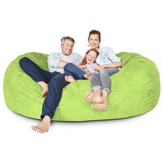 a family sitting on a bean bag chair