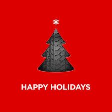 a red background with a black christmas tree on it and the words happy holidays written in white