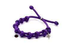 Let people know that you're a believer with this adjustable single decade rosary bracelet adorned with a silver plated mini cross and stainless steel ring. This bracelet is one-size-fits-all so sizing isn't an issue. Slide over your hand and with tugging the knots you'll have a great fit. Handcrafted in USA with 100% American Paracord. Many colors available --------------------------------------------------------------------------- Do you want another color? Request a custom order and have somet Blue Rosary, Decade Rosary, Mini Cross, Rosary Bracelet, 550 Paracord, Rosary Beads, Stainless Steel Ring, Stainless Steel Rings, Steel Ring