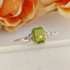 Material :- Silver Primary Stone : - Natural Green Peridot Item Weight :- Approx. 1.85 Grams Approx. Stone treatment :- 100% Natural Stone Size :- 7 MM X 5 MM Stone Shape :- Octagon Cut Secondary Stone : White Topaz ( 6 Stone) Metal :- 925 Solid Sterling Silver Purity :- 925 Select Size in Variation , if you don't find perfect size please buy any size and message us your size we'll make Payment Policy We accept payment through PayPal. All payments must be made within 7 days of purchase. If you a Peridot Engagement Rings, Green Jewelry, Peridot Ring, Green Peridot, Rings Cool, Love Ring, White Topaz, 1 Carat, Yellow Gold Rings