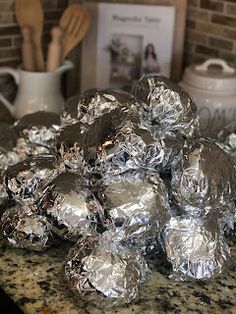 a pile of silver foil sitting on top of a counter