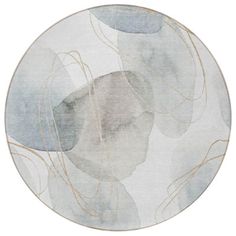 a round rug with an abstract design in grey and gold on the bottom, along with white background