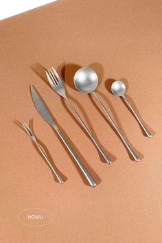 Consciously placed, from the left, a fruit fork, dinner knife, dinner fork, dinner spoon and tea spoon. Featured in brushed silver. Dinner Party Tablescapes, Room Wishlist, Cutlery Design, Stainless Kitchen, Silver Cutlery, Kitchen Cutlery, Tableware Design, Apartment Aesthetic, Tea Spoon