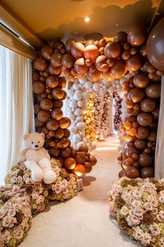 balloons and teddy bears decorate the entrance to a wedding reception at ballonland paper