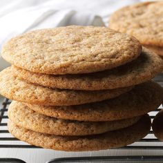 a stack of cookies sitting on top of a cooling rack