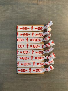 four red arrows on white fabric with the number 66 printed on them, sitting next to each other