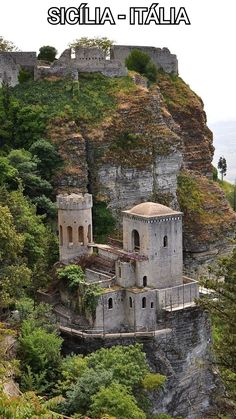 an old castle perched on top of a cliff