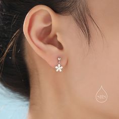 A dainty pair of earrings featuring a cute flower design.  Sold as a pair.  Complete with sterling silver butterfly backs.  Dimensions : 8mm flower. Materials and Care: These are made of sterling silver, they have been partially coated with 18ct gold plating. Only precious metals are used and they are hypoallergenic. Please keep in a sealed plastic bag when not wearing.  Packaging: All our jewellery comes with our branded velvet bag so your item is ready to be gifted.    Production Method: Small Batch lost wax casting.  ------------------------------------------------------------------- ★Free Shipping for UK orders. International orders with a flat postage fee. All our items are ready to ship within 48 hours. Orders arrive within 5 working days for UK orders and international delivery time Hypoallergenic White Gold Flower-shaped Jewelry, Dainty Nickel-free Flower Earrings For Anniversary, Hypoallergenic Sterling Silver Flower Earrings For Wedding, Dainty Flower Charm Earrings For Anniversary, Dainty Hypoallergenic Flower Earrings, Dainty White Sterling Silver Flower Earrings, Teardrop Earrings With Flower Charm, White Sterling Silver Dangle Flower Earrings, Hypoallergenic White Gold Flower Earrings In Sterling Silver