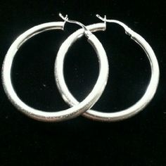 These Round Hoops Are Made In 925 Sterling Silver. Detailed With A Star Dust Satin Texture And Secured With A Hinge Closure. And Of Course Finished In Rhodium.. Rhodium Jewelry, Satin Texture, Star Dust, How To Make Earrings, Stardust, Of Course, Silver Bracelet, Hoop Earrings, Jewelry Earrings