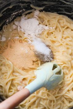 a pot filled with noodles and powdered sugar