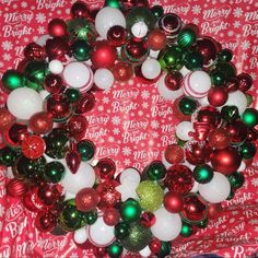 Brighten Up Your Home This Holiday Season With This Festive Wreath. Featuring A Beautiful Mix Of Red, Green, And White Ornaments, It's Perfect For Adding A Touch Of Holiday Cheer To Any Space. Festive Wreath, White Ornaments, Holiday Wreath, Wreath Crafts, Holiday Wreaths, Holiday Festival, Green And White, Holiday Cheer, Red Green