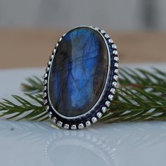 Labradorite 925 Sterling Silver Ring, Huge Blue Labradorite Gemstone 18K Rose Gold, 18K Yellow Gold Jewelry, Unique gift Ring Gemstone : Labradorite Stone Size : 24 x 14 mm Ring Size : Please Choose Your Size stone Color : Blue Material : Sterling silver It's a unique gift for anyone zodiac style ring . Please Notice before checkout :- Due to we use natural stones, the stones may vary slightly in shape, size and color. Contact us for any other gemstone customization before checkout. We ship parc Sapphire Colored Moonstone Ring As Gift, Sapphire Color Moonstone Ring As A Gift, Sapphire Moonstone Ring Perfect As A Gift, Labradorite Rings With Natural Stones For Gift, Blue Labradorite Rings As Gift, Blue Labradorite Rings For Gift, Blue Labradorite Rings For Gifts, Gift Blue Labradorite Rings, Yellow Gold Amethyst Ring