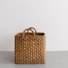 a woven basket sitting on top of a table