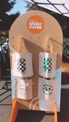 two bags are on display at an outdoor event