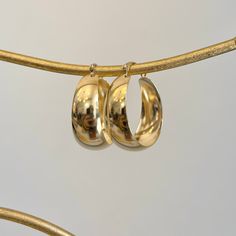 14KT yellow gold wide + chunky, tapered hoop earrings. Medium size round hoops with yummy chunkiness to make a statement. Length: 27mm Width: 24mm Thickness: 10.5mm (at widest point) Tapers Weight: 3.50 grams Stamped 14K Wire + clutch backs 90s Gold Hoop Earrings, Gold Hoops Chunky, Real Gold Hoop Earrings, Chunky Gold Earrings, Hoop Earrings Medium, Gold Hoops Earrings, Thick Gold Hoops, Chunky Gold Hoop Earrings, Saint Jewelry