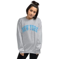 New York Oversized Varsity Lettering Crew Neck Sweatshirt will keep you cozy! Stay comfy while you work from home or run errands. Great for travel, camping, or hiking, too! Looking for additional graphic chic apparel? Check these out: https://www.etsy.com/shop/TheGraphicPeach?ref=seller-platform-mcnav§ion_id=30396058 Our shop uses direct-to-garment printing to make our products. The design ink is sprayed on, then allowed to soak into the fibers of the garment. This process yields fine quality pr Nyc Sweatshirt, Varsity Letter, Sweatshirt For Women, Great T Shirts, Crew Sweatshirts, Graphic Tee Shirts, Work From Home, Unisex Sweatshirt, From Home