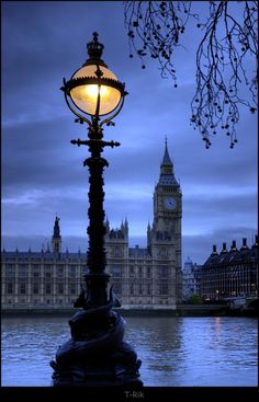 the big ben clock tower towering over the city of london, england at night time