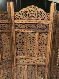 an old wooden screen with intricate carvings on it