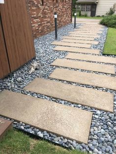 a walkway made out of stones and gravel