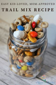 a glass jar filled with trail mix and the words easy kid - loved, mom - approved trail mix recipe