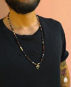 A simple and elegant Necklace for Men and Women. Made out of small natural stones (Lava Stone, Citrine, Jade, Tiger Eye, White Turquoise, Amber, etc) from Mexico and Spain. It's very light and casual, thanks to its different colors it fits perfectly with anything but is never too much. It has a very elegant silver pendant from Barcelona, that gives it a very edgy stylish touch. The minimum length of this beaded necklace for men is 70 cm, it has a silver lobster claw closure with a 5 cm chain tha Crystal Necklace Men, Minimalist Beaded Necklaces With Natural Stones For Healing, Minimalist Natural Stone Beaded Necklaces For Healing, Beaded Necklace For Men, Lava Stone Necklace, Mens Leather Necklace, Ganesha Pendant, Mens Beaded Necklaces, Necklace Men