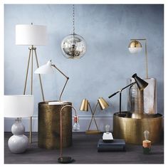 a group of different types of lamps sitting on top of a table