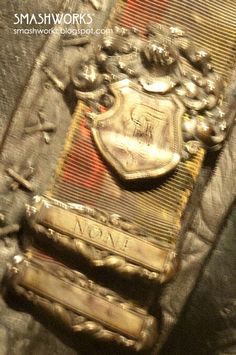 an old coat of arms on top of a piece of cloth with the word love in it