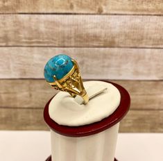 Welcome To Gold Knox Rare vintage 18K yellow gold women's ring with blue cabochon Turquoise. The stone measures 16 mm x 13 mm.Great piece with great details. Details below: Material 18k yellow gold, Turquoise Size 6 US Hallmark 18K This would make great addition to your jewelry collection. Thank you for looking PLEASE, BE SURE TO VIEW THE PICTURES CAREFULLY AND CLOSELY AS IT IS THE EXACT ITEM YOU ARE BUYING. Gold Knox Jewelry opened its storefront in Pasadena, CA in 2011, since then we do our BE Luxury Turquoise Cabochon Ring In Yellow Gold, Luxury Yellow Gold Turquoise Cabochon Ring, Luxury Turquoise Oval Cabochon Ring, Oval Turquoise Cabochon Ring In Yellow Gold, Oval Yellow Gold Turquoise Ring With Cabochon, Blue Domed Cabochon Jewelry, Luxury Blue Oval Cabochon Turquoise Ring, Formal Cabochon Turquoise Ring, Anniversary Yellow Gold Turquoise Ring With Oval Cabochon