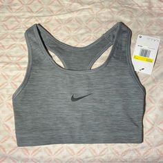 It Is Active Wear So It Is Used For Long Runs And Workouts The Color Is Grey And Can Match With Many Things. It Is New With Tags As I Am Had Bought It For Me Bad It Was The Wrong Size. Gray Sporty Tops For Training, Gray Breathable Racerback Top, Gray Racerback Functional Top, Gray Functional Racerback Top, Gray Moisture-wicking Racerback Top, Gray Stretch Sports Bra For Sports Season, Gray Racerback Activewear For Light Exercise, Fitted Gray Activewear For Light Sports, Gray Racerback Top For Training