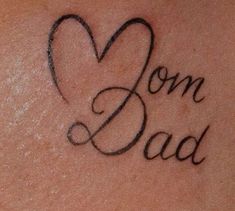 a woman's back with the words son and dad written in cursive font