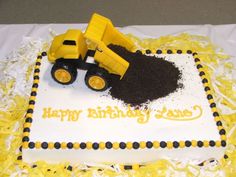 a birthday cake with a yellow and black truck on it