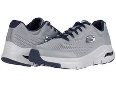 SKECHERS Arch Fit - Men's Shoes : Gray/Navy : The SKECHERS Arch Fit sneaker will enhance your outdoor style with a mixed finish design and optimal comfort features. Woven mesh fabric upper with hot-melt synthetic overlays for added structure. Lace-up design offers a secure fit. Round toe with durable reinforcement at the bumper. Padded tongue and collar. Signature logo accents at the tongue and side panel. Breathable fabric lining. Removable Arch Fit insole system with podiatrist certified arch Mens Skechers, Shoes World, Navy Man, Skechers Shoes, Outdoor Style, Sketchers Sneakers, Signature Logo, Panel Siding, Mesh Fabric