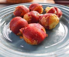 several pieces of food on a plate sitting on a table