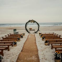 an outdoor ceremony set up on the beach