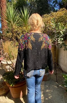 "Gorgeous beaded jacket,Sequin jacket, Formal beaded,Gold,blue,Purple,Black,XL, Large XLarge, Jewel Queen This is so Gorgeous statement piece Black beaded with Gold, purple and blue sequin Says XL Measurements: chest 40\" Length 21\" Open in the front Excellent condition. No beading or sequin noted missing NK770B1 Gorgeous beaded jacket,Sequin jacket, Formal beaded,Gold,blue,Purple,Black,XL, Large XLarge, Jewel Queen" Jacket Formal, Beaded Jacket, Sequin Jacket, Purple Black, Black Beads, Purple And Black, Blue Purple, Off Shoulder Blouse, Blue And Purple