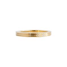 a stack of three gold rings on a white background