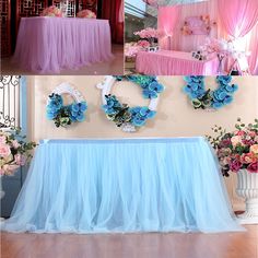 the table is set up with blue and pink flowers on it for a wedding reception