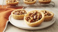 several pecan pies on a white plate