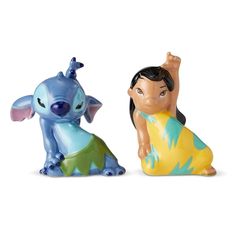 two figurines of disney characters sitting next to each other on a white background