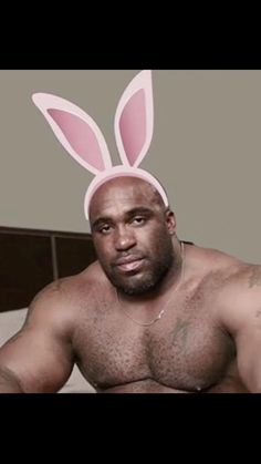 a man in bunny ears is posing for the camera