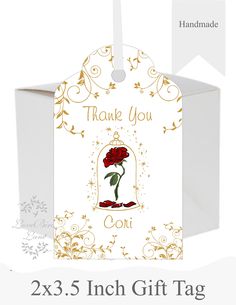 a white gift tag with a red rose on it