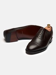 The contemporary look of The Adelaide is optimal for achieving a more simple and understated feel to your outfit. The Adelaide is crafted by hand with signature brogue punched details and U-shaped facing. It’s made on a single leather sole and is Goodyear welted, allowing for re-soling when needed. Classic Leather Shoes With Perforated Almond Toe, Classic Leather Oxford With Rubber Sole, Classic Leather Oxford Shoes With Rubber Sole, Leather Oxford With Rubber Sole For Semi-formal Occasion, Leather Oxford With Rubber Sole For Semi-formal Wear, Leather Oxford Shoes With Rubber Sole For Semi-formal, Classic Brown Oxford Shoes With Leather Sole, Classic Brown Oxford With Leather Sole, Brown Leather Goodyear Welted Oxford Shoes