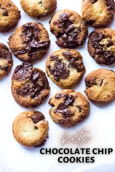 chocolate chip cookies are arranged on a piece of parchment paper