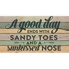 a wooden sign that says good day ends with sandy toes and a sunrise nose