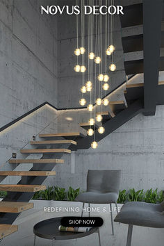 an image of a staircase with lights hanging from the ceiling and chairs in front of it